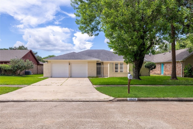 10602 Tenneta Dr, Houston, TX 77099 - single story home featuring an attached garage, concrete driveway, and a front lawn