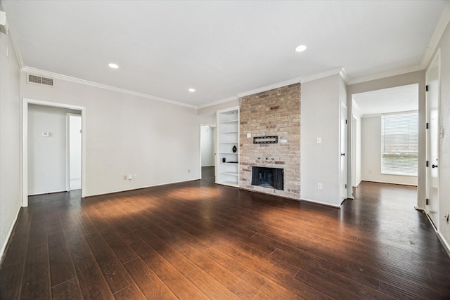 1881 Bering Dr Unit 83, Houston, TX 77057 - unfurnished living room with dark wood-style flooring, a fireplace, recessed lighting, crown molding, and built in shelves