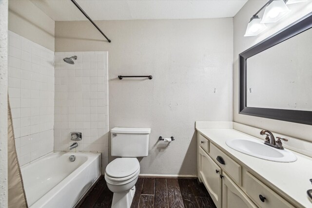 1881 Bering Dr Unit 83, Houston, TX 77057 - bathroom with vanity, shower / tub combo with curtain, and wood finished floors