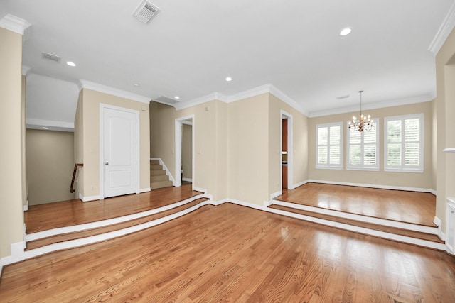 2930 Brompton Square Dr, Houston, TX 77025 - spare room with a chandelier, wood finished floors, ornamental molding, stairs, and recessed lighting