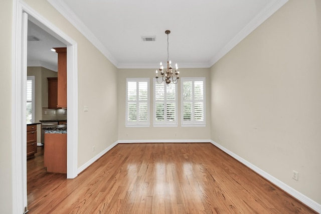 2930 Brompton Square Dr, Houston, TX 77025 - unfurnished dining area featuring light wood-style floors, a chandelier, and ornamental molding