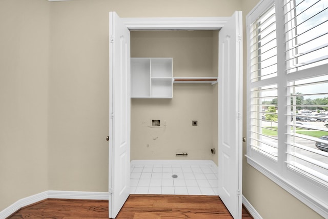 2930 Brompton Square Dr, Houston, TX 77025 - laundry room with electric dryer hookup, washer hookup, and wood finished floors