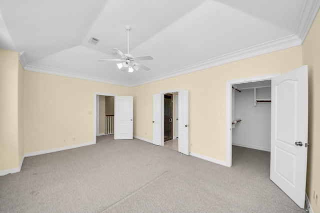 2930 Brompton Square Dr, Houston, TX 77025 - unfurnished bedroom featuring carpet floors, ornamental molding, a walk in closet, and ceiling fan