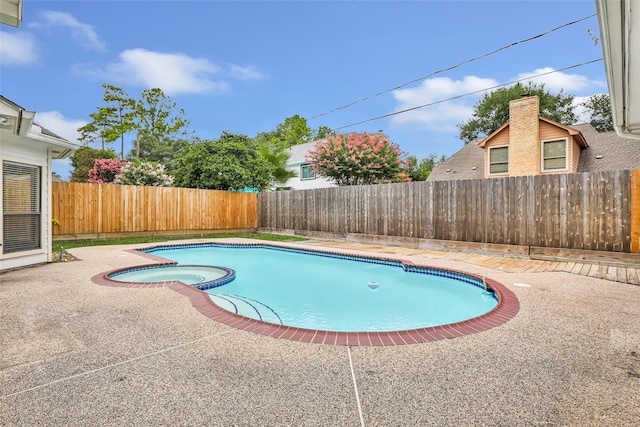 12102 Moorcreek Dr, Houston, TX 77070 - view of pool with a fenced backyard, a pool with connected hot tub, and a patio