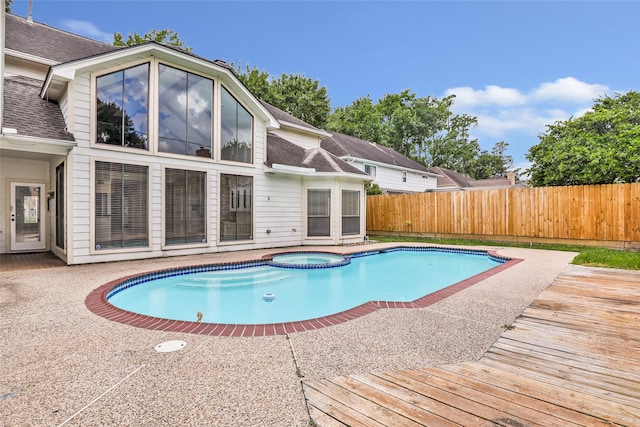 12102 Moorcreek Dr, Houston, TX 77070 - view of swimming pool featuring a fenced backyard, a pool with connected hot tub, and a deck