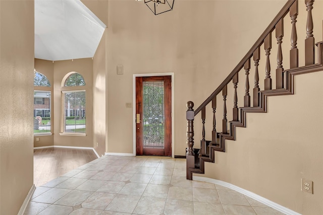 12102 Moorcreek Dr, Houston, TX 77070 - foyer featuring a towering ceiling, stairs, and a chandelier