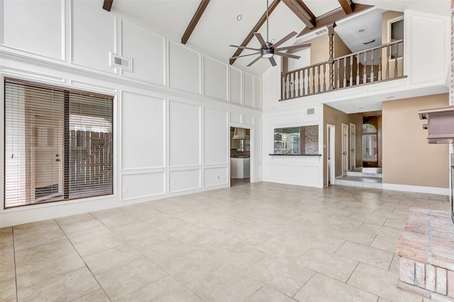 12102 Moorcreek Dr, Houston, TX 77070 - unfurnished living room featuring a decorative wall, high vaulted ceiling, a ceiling fan, beam ceiling, and light tile patterned flooring