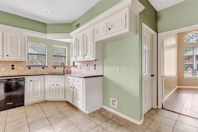 12102 Moorcreek Dr, Houston, TX 77070 - kitchen with dishwasher, light tile patterned flooring, tasteful backsplash, and white cabinets