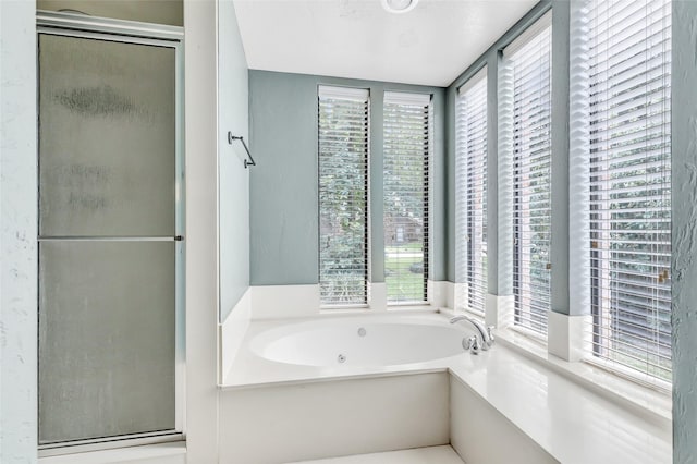 12102 Moorcreek Dr, Houston, TX 77070 - bathroom featuring a stall shower, a whirlpool tub, and healthy amount of natural light