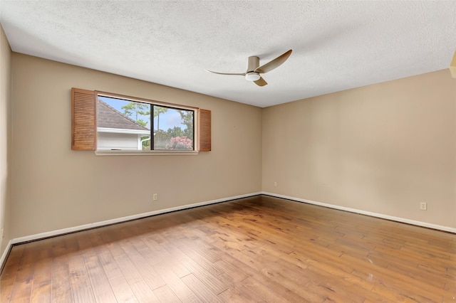 12102 Moorcreek Dr, Houston, TX 77070 - spare room featuring a ceiling fan, wood finished floors, and a textured ceiling