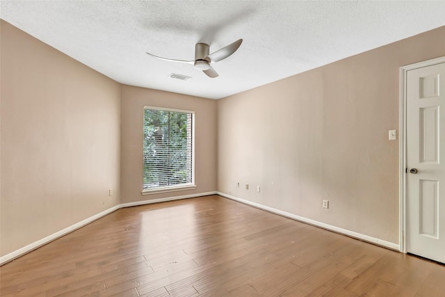 12102 Moorcreek Dr, Houston, TX 77070 - spare room featuring a ceiling fan, wood finished floors, and a textured ceiling