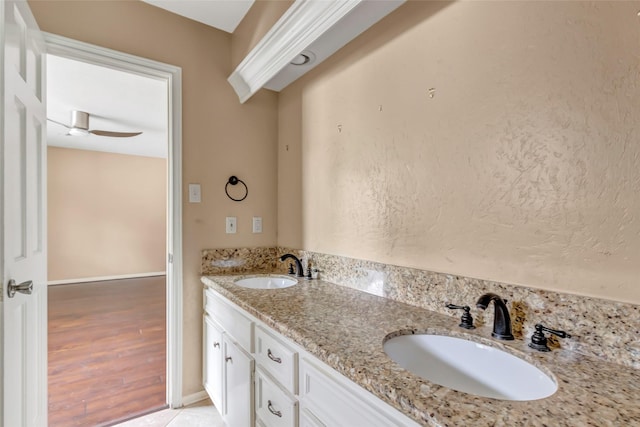 12102 Moorcreek Dr, Houston, TX 77070 - bathroom featuring double vanity and wood finished floors