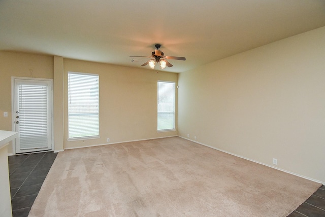 2814 Edgewick Elm St, Fresno, TX 77545 - unfurnished room with ceiling fan, plenty of natural light, and dark tile patterned floors
