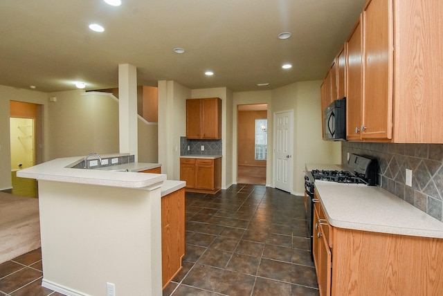 2814 Edgewick Elm St, Fresno, TX 77545 - kitchen featuring black microwave, range with gas cooktop, decorative backsplash, recessed lighting, and light countertops