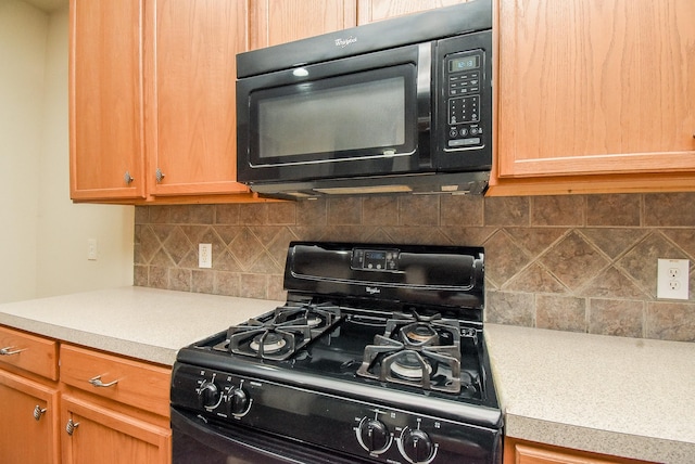 2814 Edgewick Elm St, Fresno, TX 77545 - kitchen featuring black appliances, light countertops, and decorative backsplash