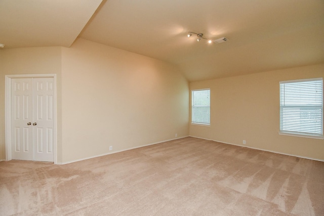 2814 Edgewick Elm St, Fresno, TX 77545 - spare room with light colored carpet and vaulted ceiling