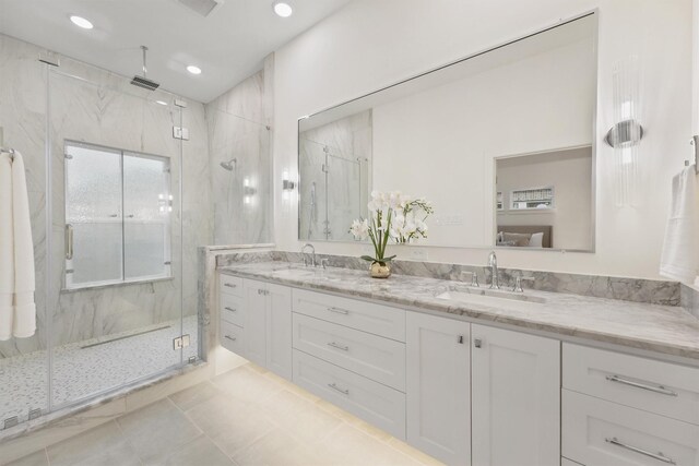 5405 Dickson St, Houston, TX 77007 - full bath featuring double vanity, a marble finish shower, tile patterned flooring, and recessed lighting