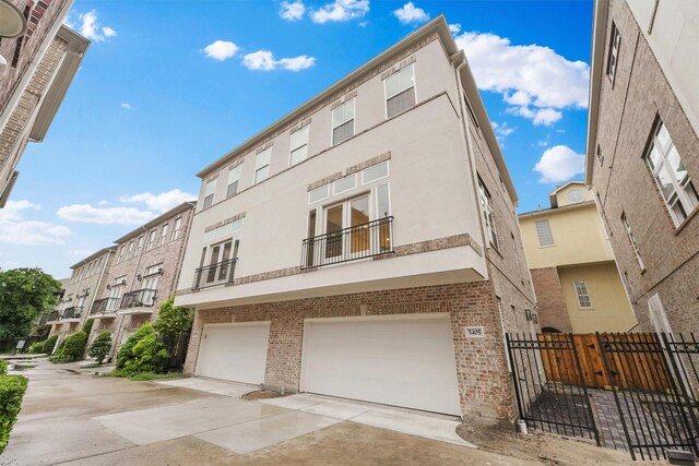 5405 Dickson St, Houston, TX 77007 - view of building exterior with concrete driveway and a garage