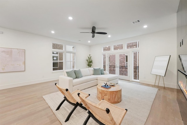5405 Dickson St, Houston, TX 77007 - living area featuring ceiling fan, light wood-style floors, recessed lighting, and french doors