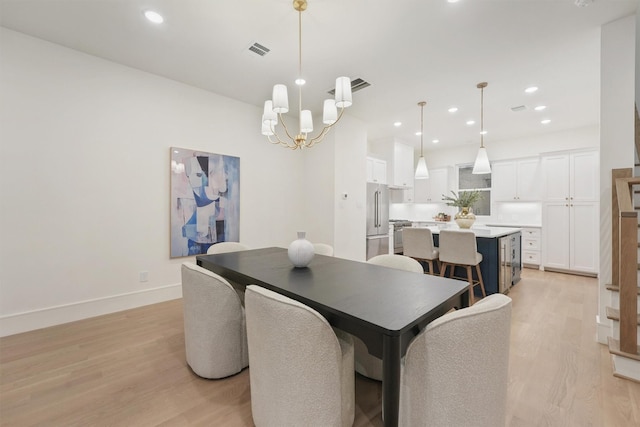 5405 Dickson St, Houston, TX 77007 - dining area featuring light wood finished floors, a chandelier, and recessed lighting