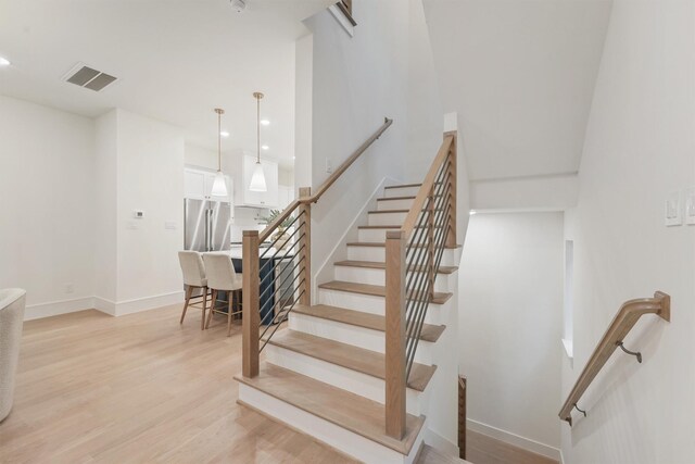 5405 Dickson St, Houston, TX 77007 - staircase featuring wood finished floors and recessed lighting