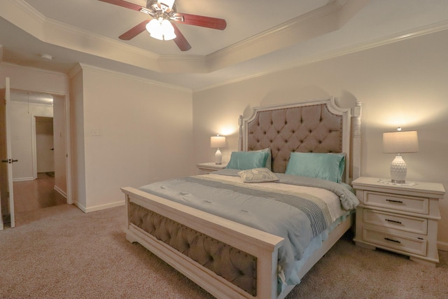 17803 Inland Oaks Dr, Richmond, TX 77407 - bedroom with light colored carpet, a tray ceiling, crown molding, and a ceiling fan