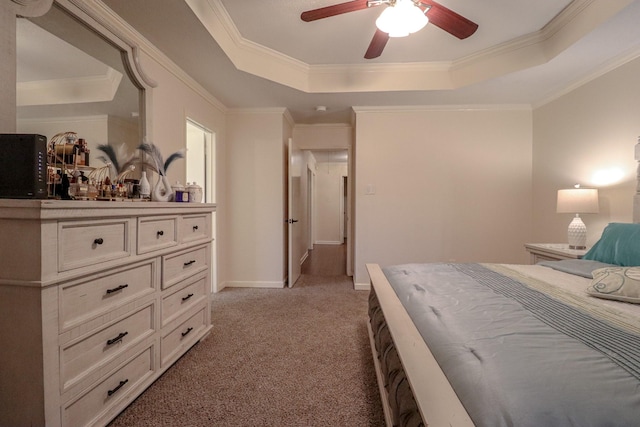 17803 Inland Oaks Dr, Richmond, TX 77407 - bedroom featuring a raised ceiling, light carpet, ornamental molding, and a ceiling fan