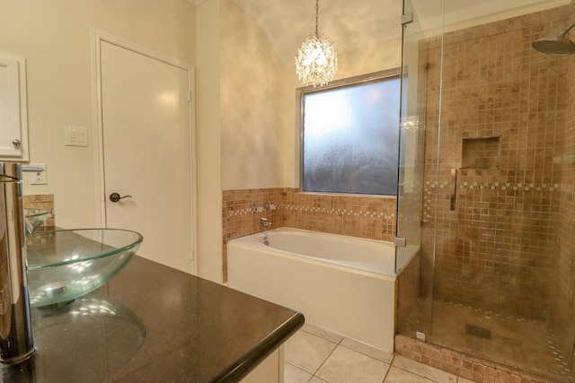 17803 Inland Oaks Dr, Richmond, TX 77407 - bathroom with a shower stall, a bath, tile patterned flooring, and a chandelier