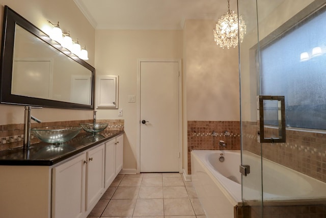 17803 Inland Oaks Dr, Richmond, TX 77407 - full bath with double vanity, a garden tub, tile patterned floors, ornamental molding, and a chandelier