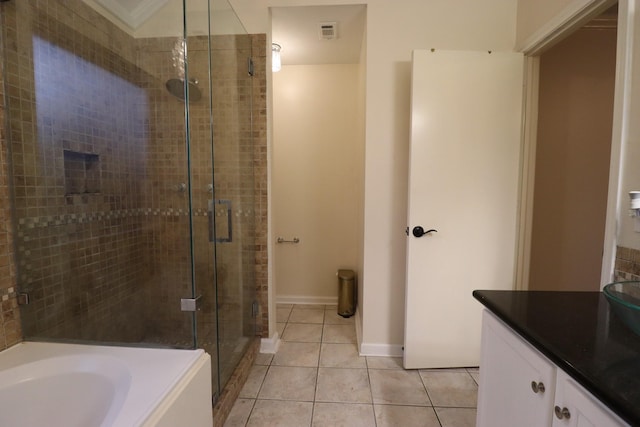 17803 Inland Oaks Dr, Richmond, TX 77407 - full bathroom featuring a stall shower, tile patterned floors, a bath, and vanity