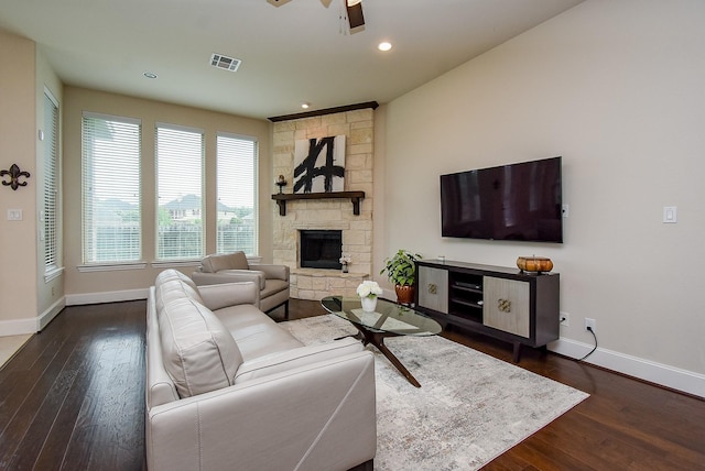 19750 Lago Terrace Loop, Richmond, TX 77407 - living area featuring a ceiling fan, dark wood finished floors, a stone fireplace, and recessed lighting