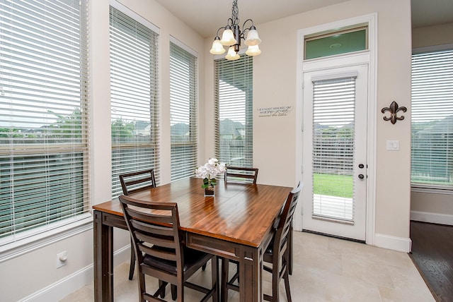 19750 Lago Terrace Loop, Richmond, TX 77407 - dining area featuring a chandelier and baseboards