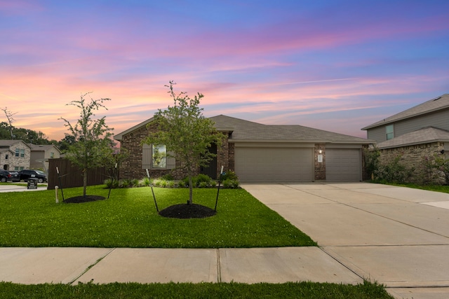 14205 Dream Rd, New Caney, TX 77357 - single story home with concrete driveway, a garage, a lawn, and brick siding
