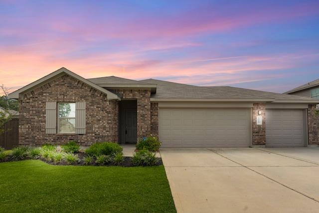 14205 Dream Rd, New Caney, TX 77357 - view of front of property with brick siding, a garage, concrete driveway, a front yard, and roof with shingles