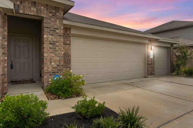 14205 Dream Rd, New Caney, TX 77357 - garage featuring concrete driveway