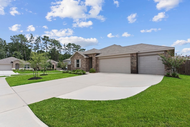 14205 Dream Rd, New Caney, TX 77357 - view of front of house with brick siding, an attached garage, and driveway