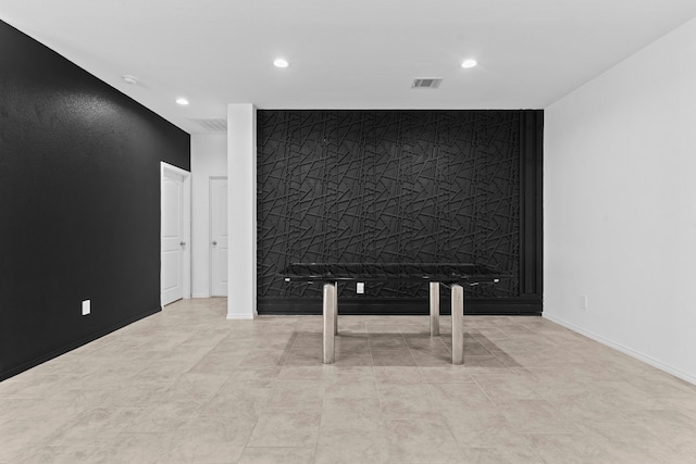 14205 Dream Rd, New Caney, TX 77357 - unfurnished room with an accent wall and recessed lighting