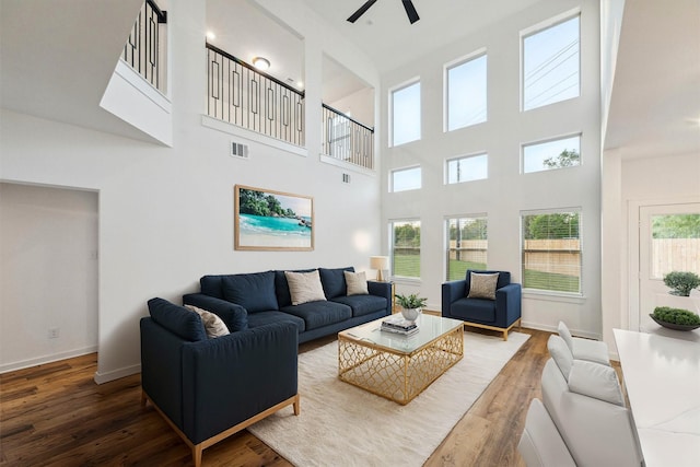 390 Kendall Crest Dr, Alvin, TX 77511 - living area featuring a ceiling fan, wood finished floors, and a high ceiling
