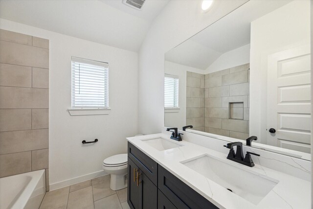 390 Kendall Crest Dr, Alvin, TX 77511 - full bath with double vanity, vaulted ceiling, and tile patterned flooring