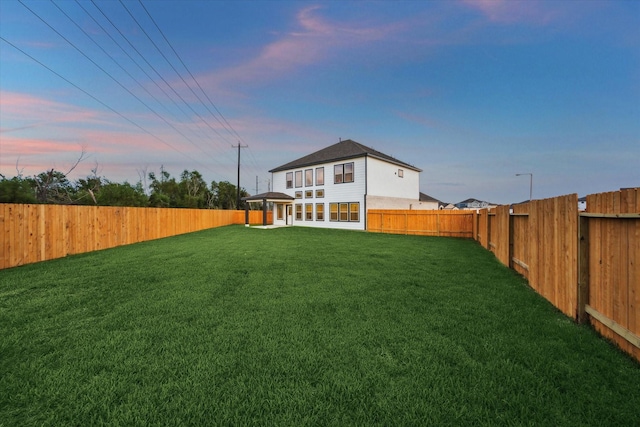 390 Kendall Crest Dr, Alvin, TX 77511 - yard at dusk featuring a fenced backyard