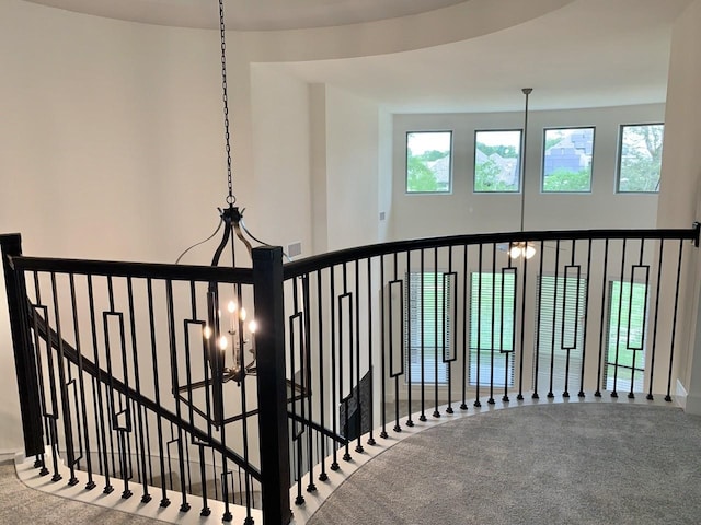 12515 Tullich Run Dr, Humble, TX 77346 - staircase featuring carpet and a chandelier