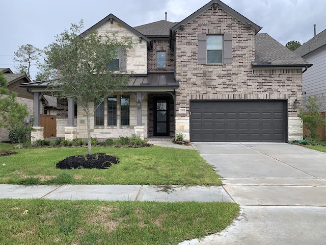 12515 Tullich Run Dr, Humble, TX 77346 - view of front of property featuring an attached garage, driveway, a front lawn, brick siding, and roof with shingles