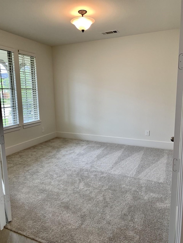 12515 Tullich Run Dr, Humble, TX 77346 - spare room featuring baseboards and carpet floors