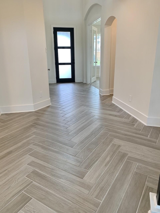 12515 Tullich Run Dr, Humble, TX 77346 - spare room featuring arched walkways and baseboards