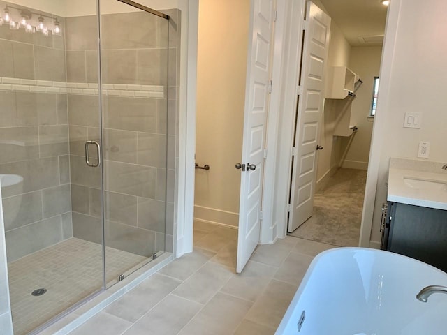 12515 Tullich Run Dr, Humble, TX 77346 - full bath with a shower stall, a freestanding tub, tile patterned flooring, and vanity