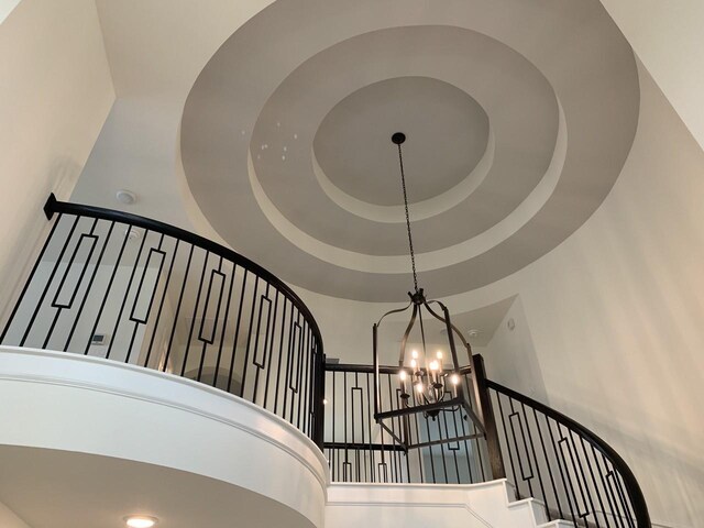 12515 Tullich Run Dr, Humble, TX 77346 - staircase with a chandelier and a high ceiling
