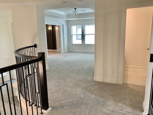 12515 Tullich Run Dr, Humble, TX 77346 - hall featuring an upstairs landing, carpet floors, a tray ceiling, and arched walkways