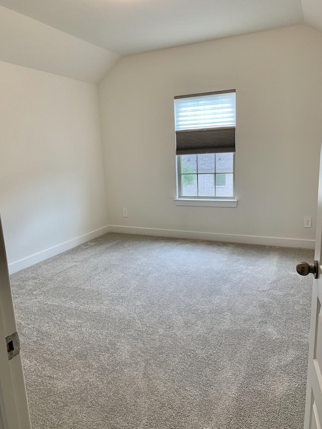 12515 Tullich Run Dr, Humble, TX 77346 - unfurnished room with vaulted ceiling and carpet flooring
