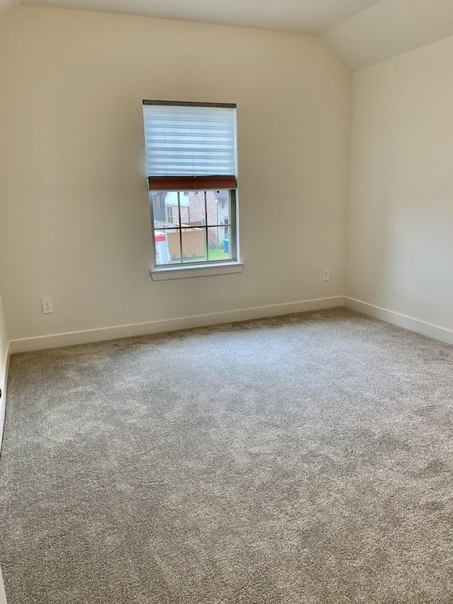 12515 Tullich Run Dr, Humble, TX 77346 - spare room featuring vaulted ceiling and carpet