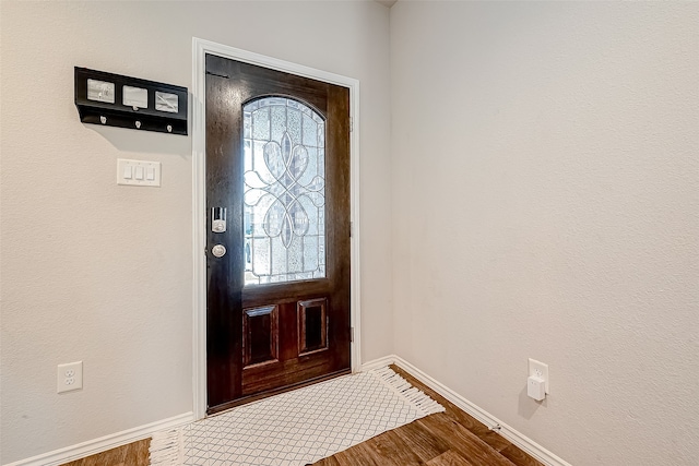 18623 Swainboro Dr, New Caney, TX 77357 - foyer with baseboards and wood finished floors